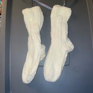 Fuzzy grippy socks never worn, not sure why the grips are stained pink